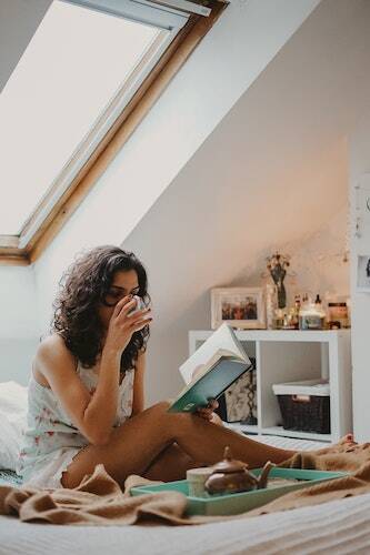 Woman on bed reading