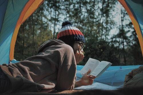 Woman in tent reading