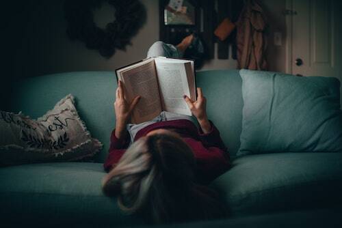 Woman reading on couch