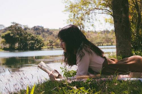 Reading in the sun by the water