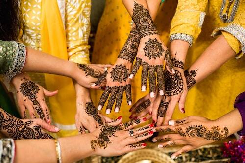 Women with mehendi on hands