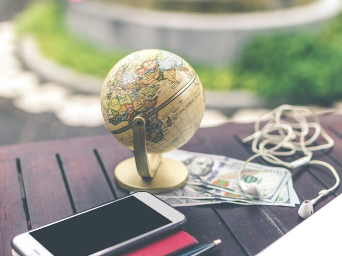 A small globe sitting on a table, representing the global perspective and reach of international journalism.