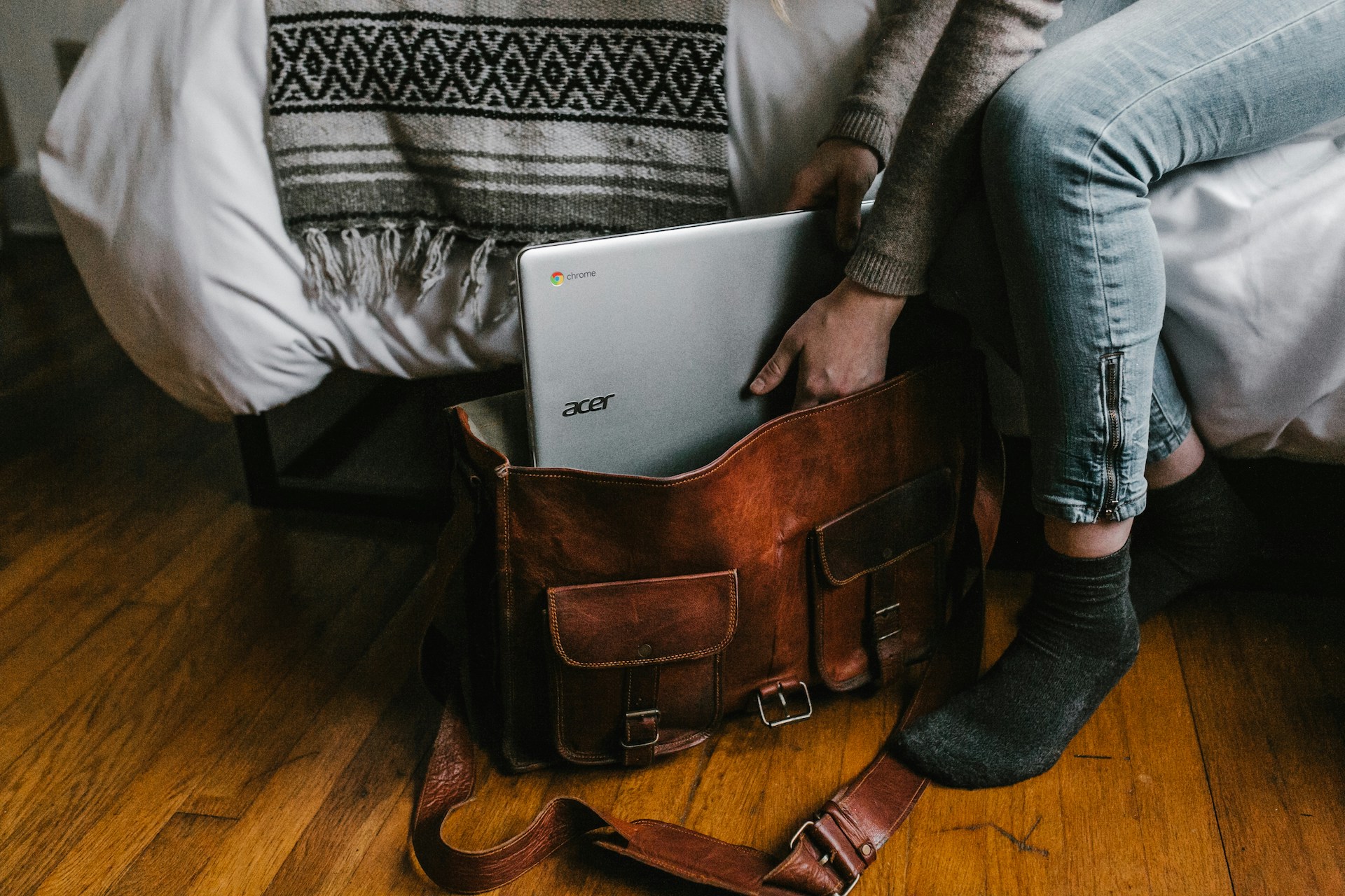 A person packing a bag, symbolizing the role of journalists in seeking and reporting solutions to societal challenges—core to solutions journalism.